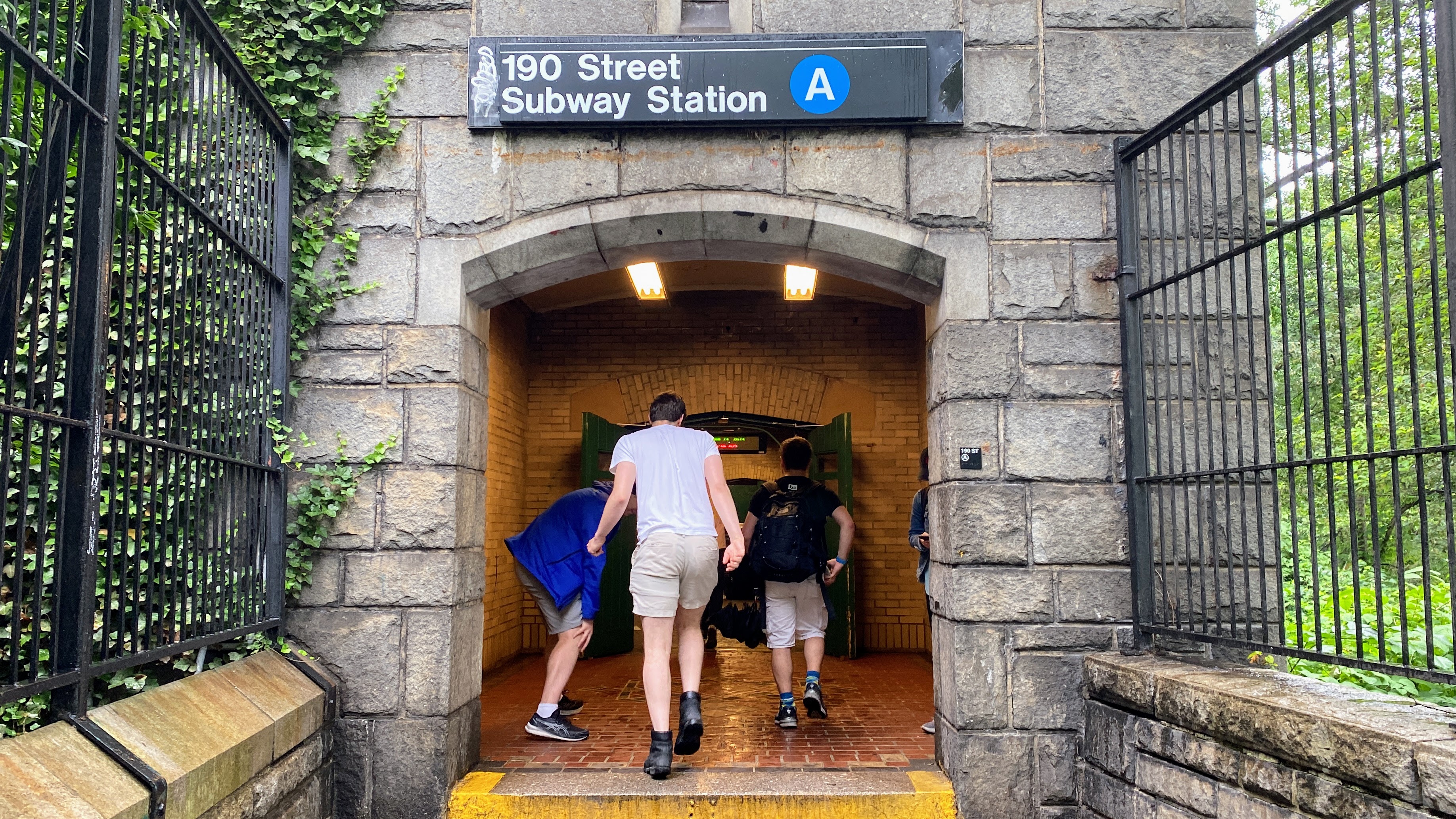 The group entering the 190 St subway station.